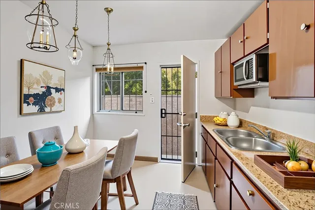 a kitchen that has a stove and a table