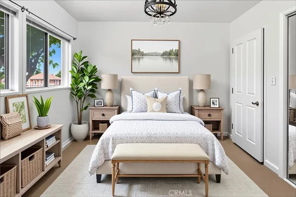 a bedroom with a bed and a painting on the wall