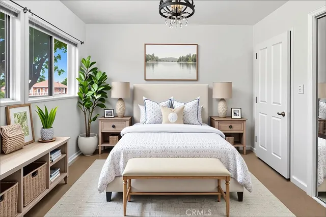 a bedroom with a bed and a painting on the wall