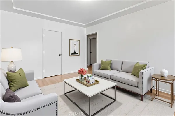 a living room with furniture and a lamp