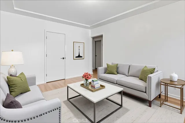 a living room with furniture and a lamp