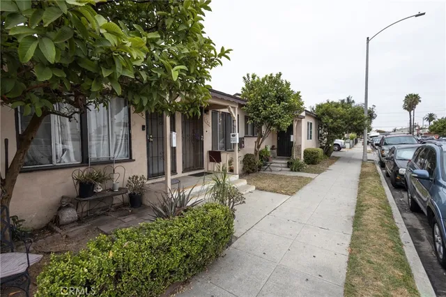 a view of a patio with chairs and plants