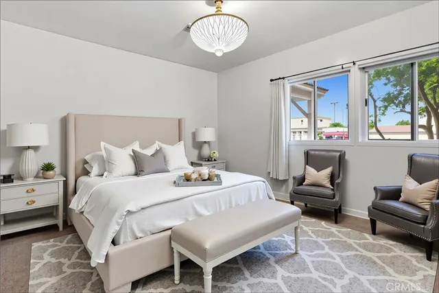 a bedroom with a bed and a couch