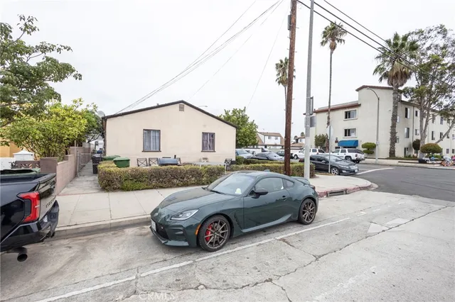 a view of a car parked in front of a house