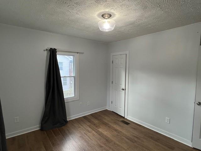 5850 Old Bill Cook Road, Unit FRONT Atlanta, GA 30349 - Photo 12 of 19 an empty room with wooden floor and closet