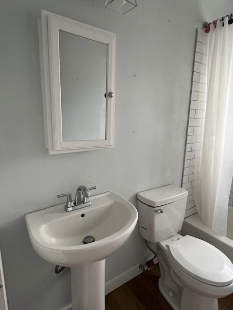 5850 Old Bill Cook Road, Unit FRONT Atlanta, GA 30349 - Photo 14 of 19 a white toilet sitting next to a bathroom sink