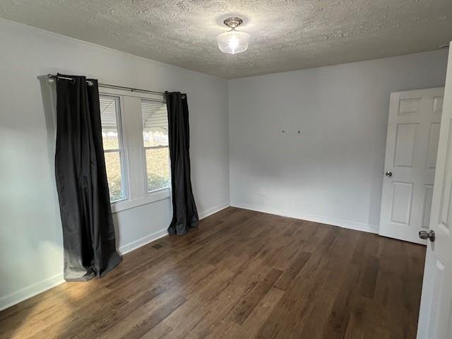 5850 Old Bill Cook Road, Unit FRONT Atlanta, GA 30349 - Photo 18 of 19 an empty room with wooden floor and windows