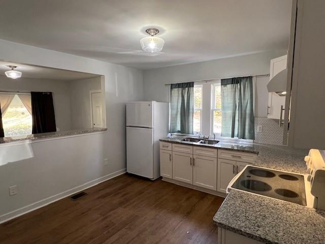 5850 Old Bill Cook Road, Unit FRONT Atlanta, GA 30349 - Photo 3 of 19 a kitchen with refrigerator and window