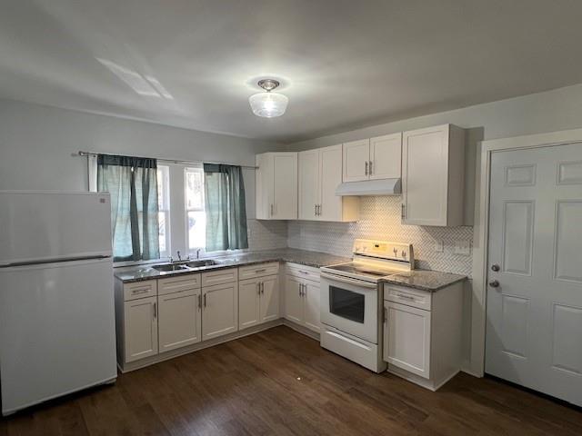 5850 Old Bill Cook Road, Unit FRONT Atlanta, GA 30349 - Photo 4 of 19 a kitchen with stainless steel appliances granite countertop white cabinets a sink a stove a refrigerator and white cabinets