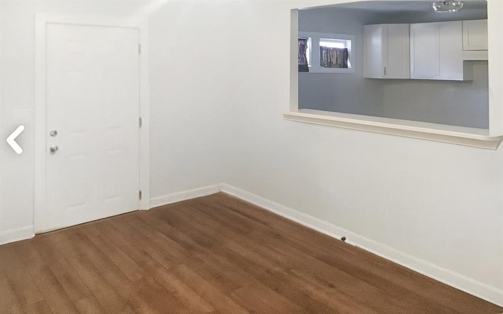 5850 Old Bill Cook Road, Unit FRONT Atlanta, GA 30349 - Photo 8 of 19 a view of a small space with wooden floor and a window