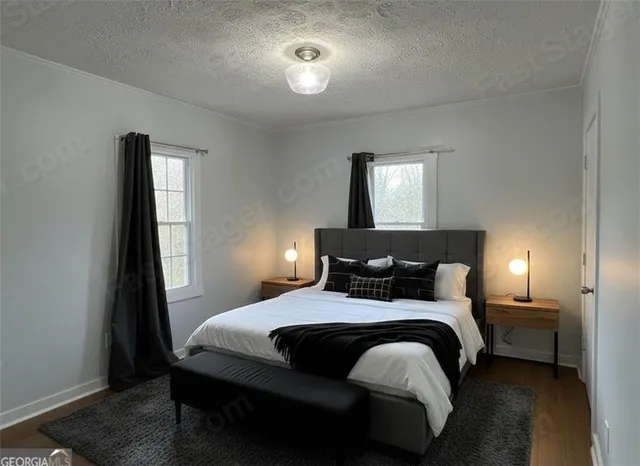 a bedroom with a bed and a lamp with window