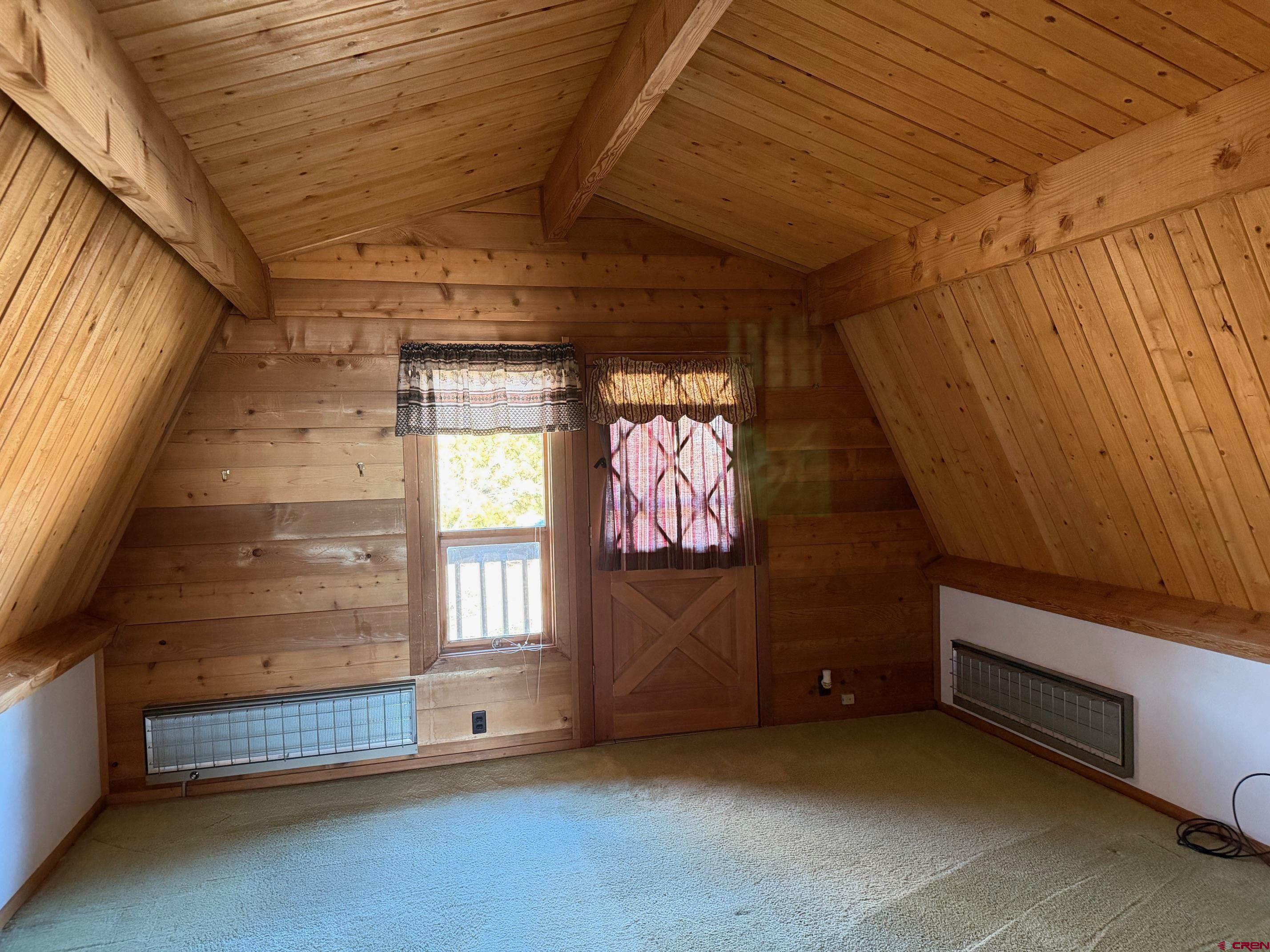 25926 Q25 Road Cedaredge, CO 81413 - Photo 13 of 32 a view of an empty room with a fireplace