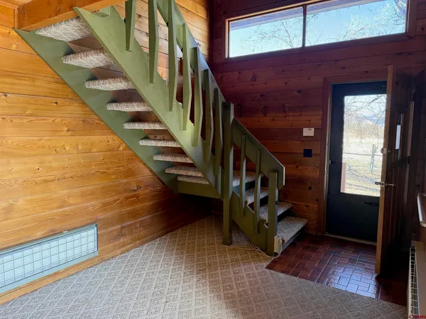 a view of storage and utility room with washer and dryer