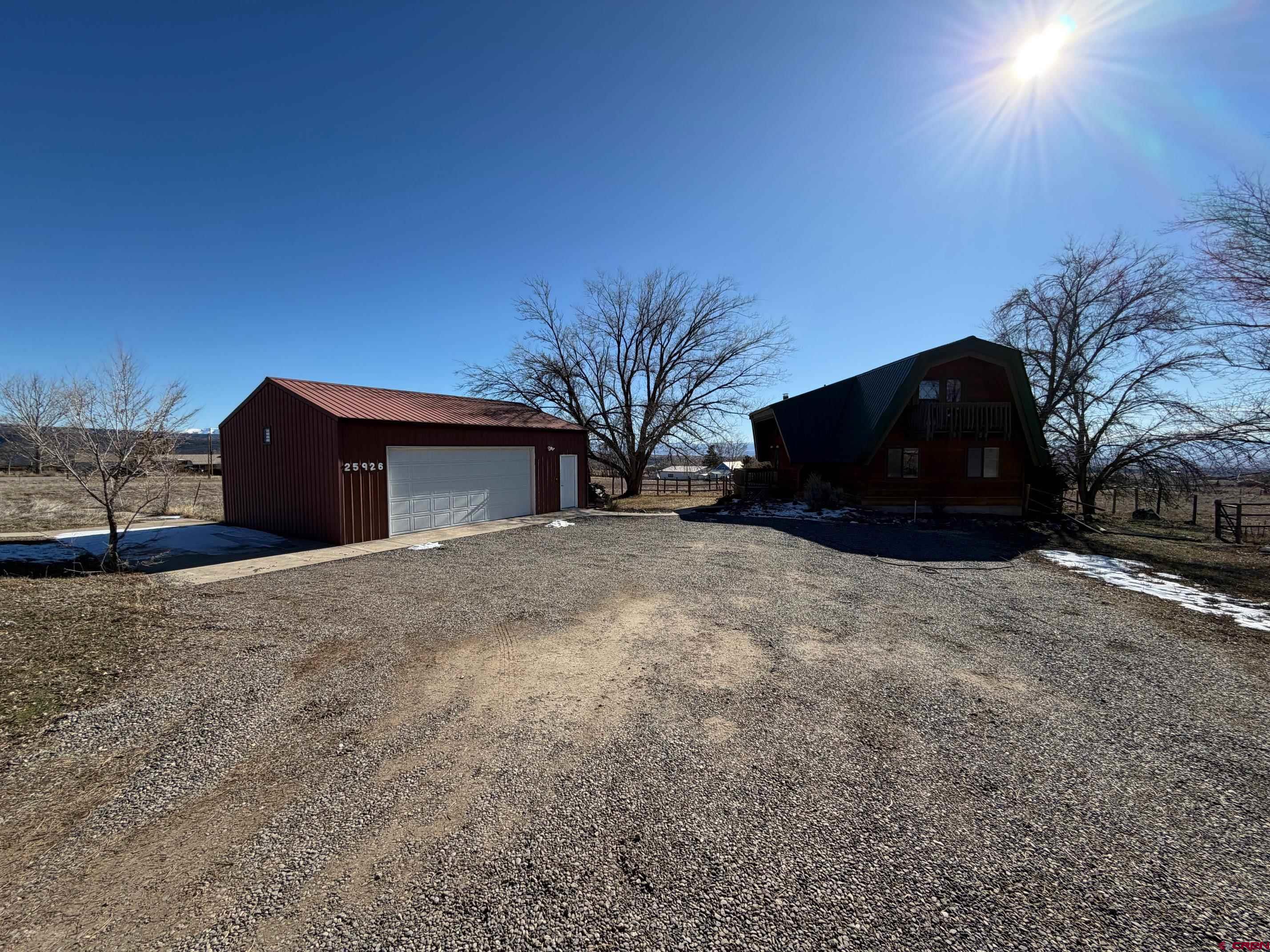 25926 Q25 Road Cedaredge, CO 81413 - Photo 31 of 32 a view of a house with a yard