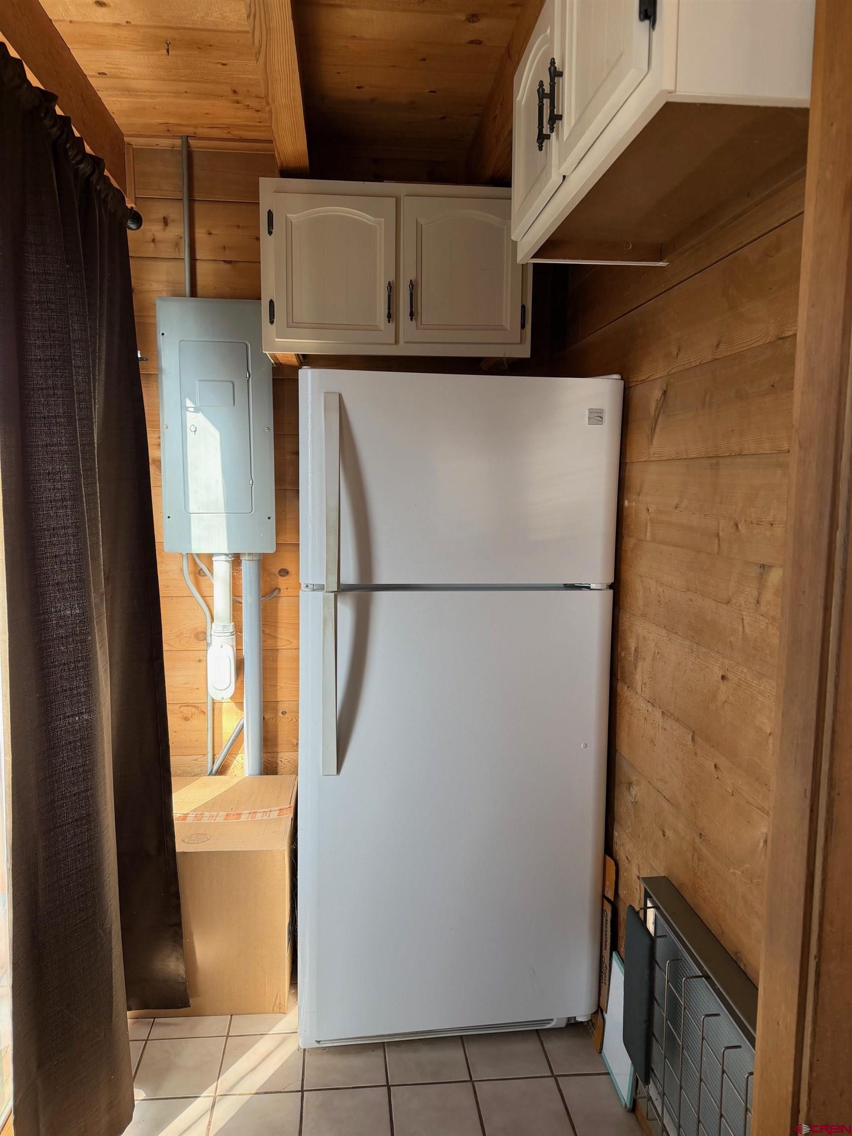 25926 Q25 Road Cedaredge, CO 81413 - Photo 6 of 32 a view of storage and utility room with washer and dryer