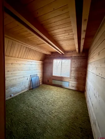 a view of an empty room with a fireplace