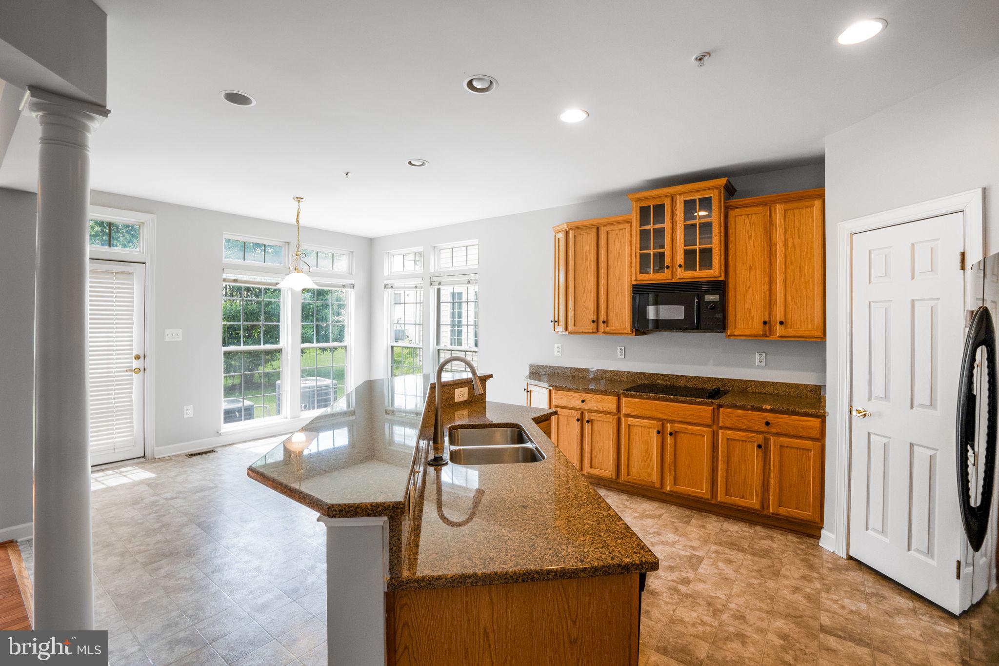 14108 Chivas Circle Laurel, MD 20707 - Photo 12 of 51 a kitchen with stainless steel appliances granite countertop sink stove and refrigerator