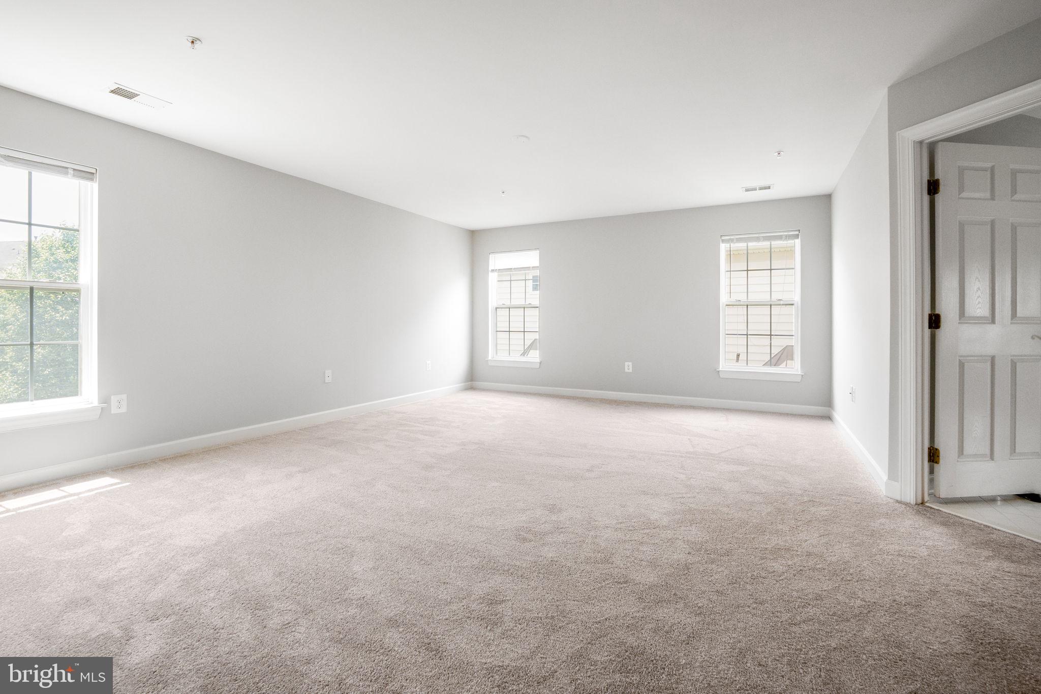 14108 Chivas Circle Laurel, MD 20707 - Photo 21 of 51 an empty room with windows and closet