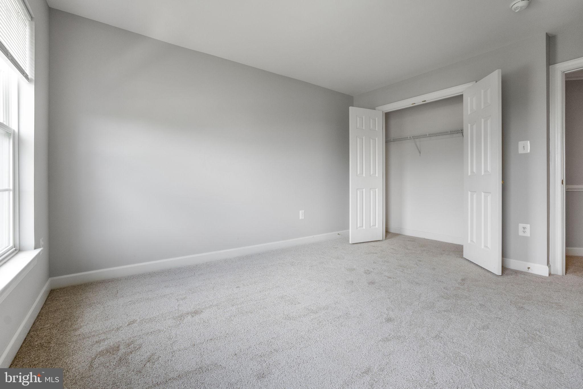 14108 Chivas Circle Laurel, MD 20707 - Photo 35 of 51 an empty room with windows and closet
