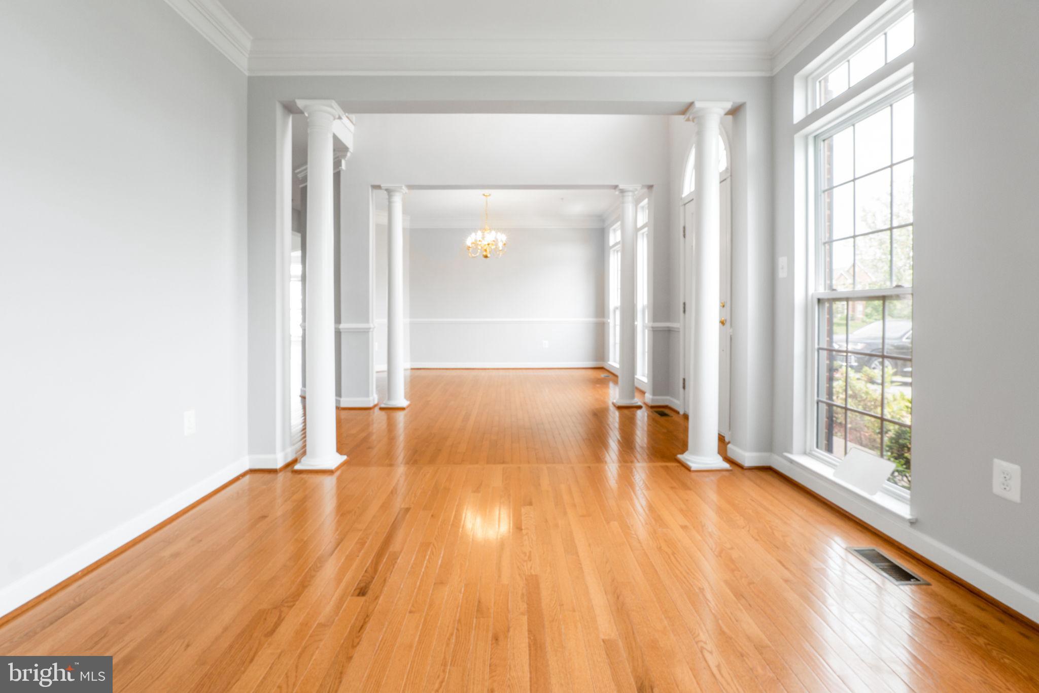 14108 Chivas Circle Laurel, MD 20707 - Photo 4 of 51 an empty room with wooden floor and windows