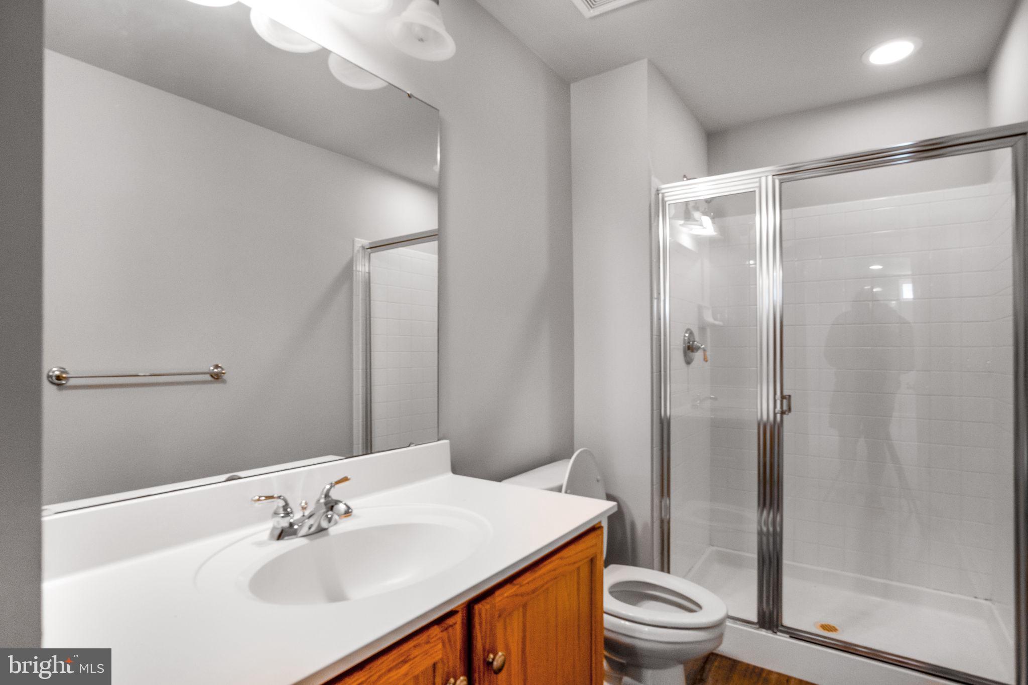 14108 Chivas Circle Laurel, MD 20707 - Photo 43 of 51 a bathroom with a sink toilet and shower