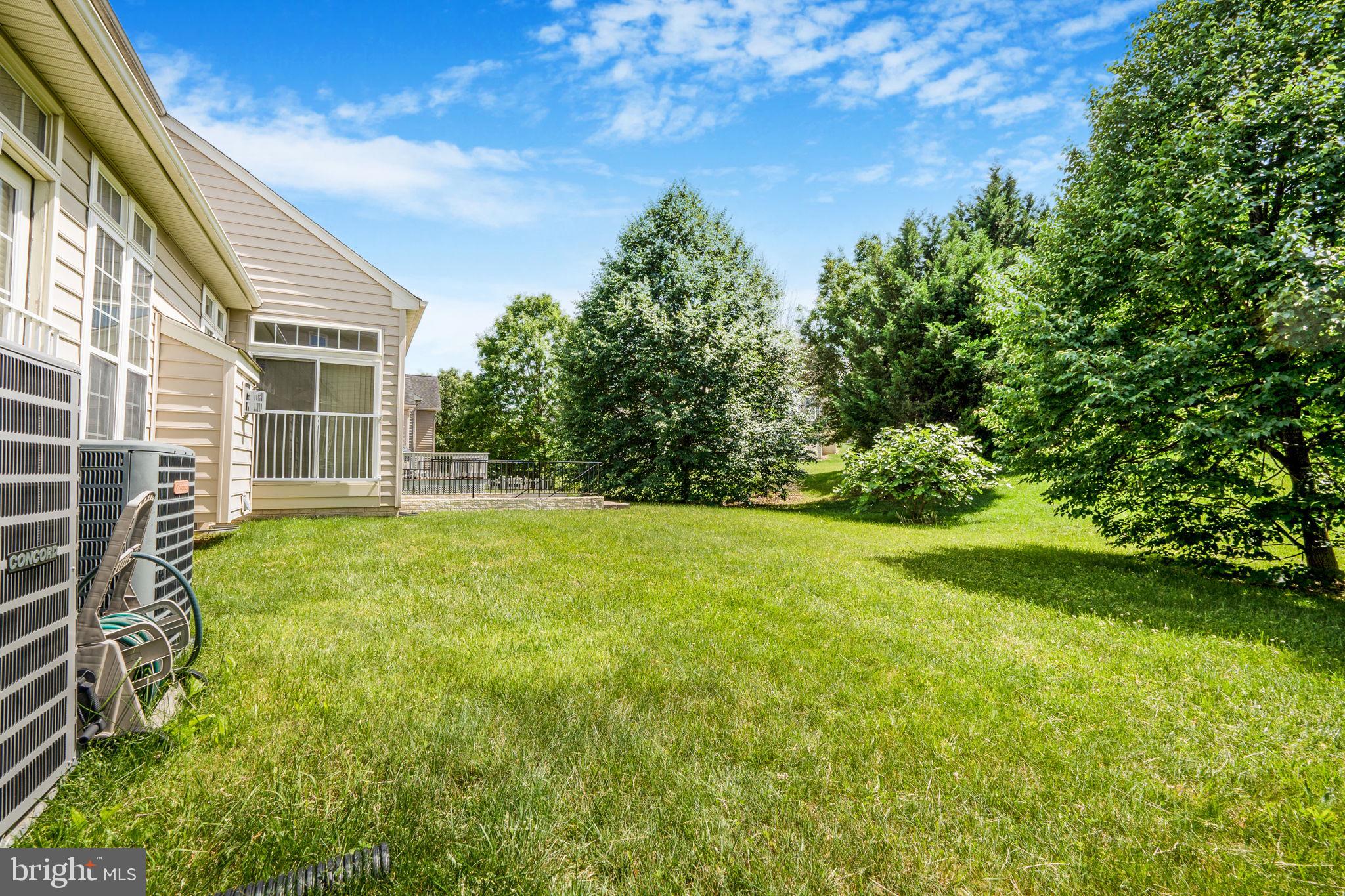 14108 Chivas Circle Laurel, MD 20707 - Photo 50 of 51 a view of a backyard with plants and large trees
