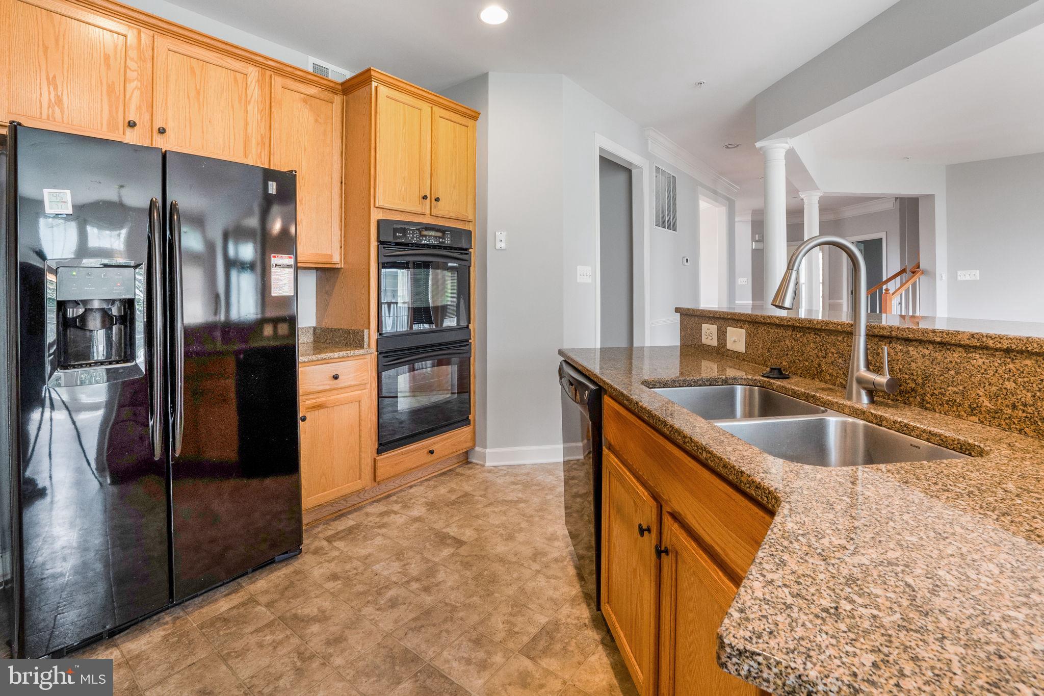 14108 Chivas Circle Laurel, MD 20707 - Photo 10 of 51 a kitchen with stainless steel appliances granite countertop a refrigerator a sink and a stove