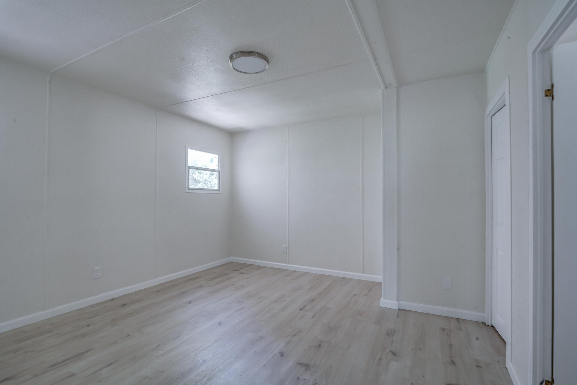 821 St Marks Street, Unit 1 Redding, CA 96003 - Photo 18 of 26 a view of empty room with wooden floor and fan