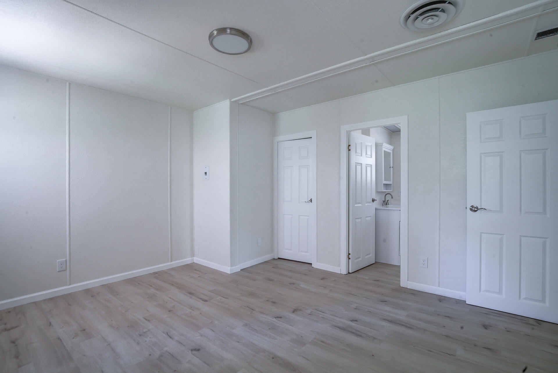 821 St Marks Street, Unit 1 Redding, CA 96003 - Photo 19 of 26 a view of an empty room with wooden floor