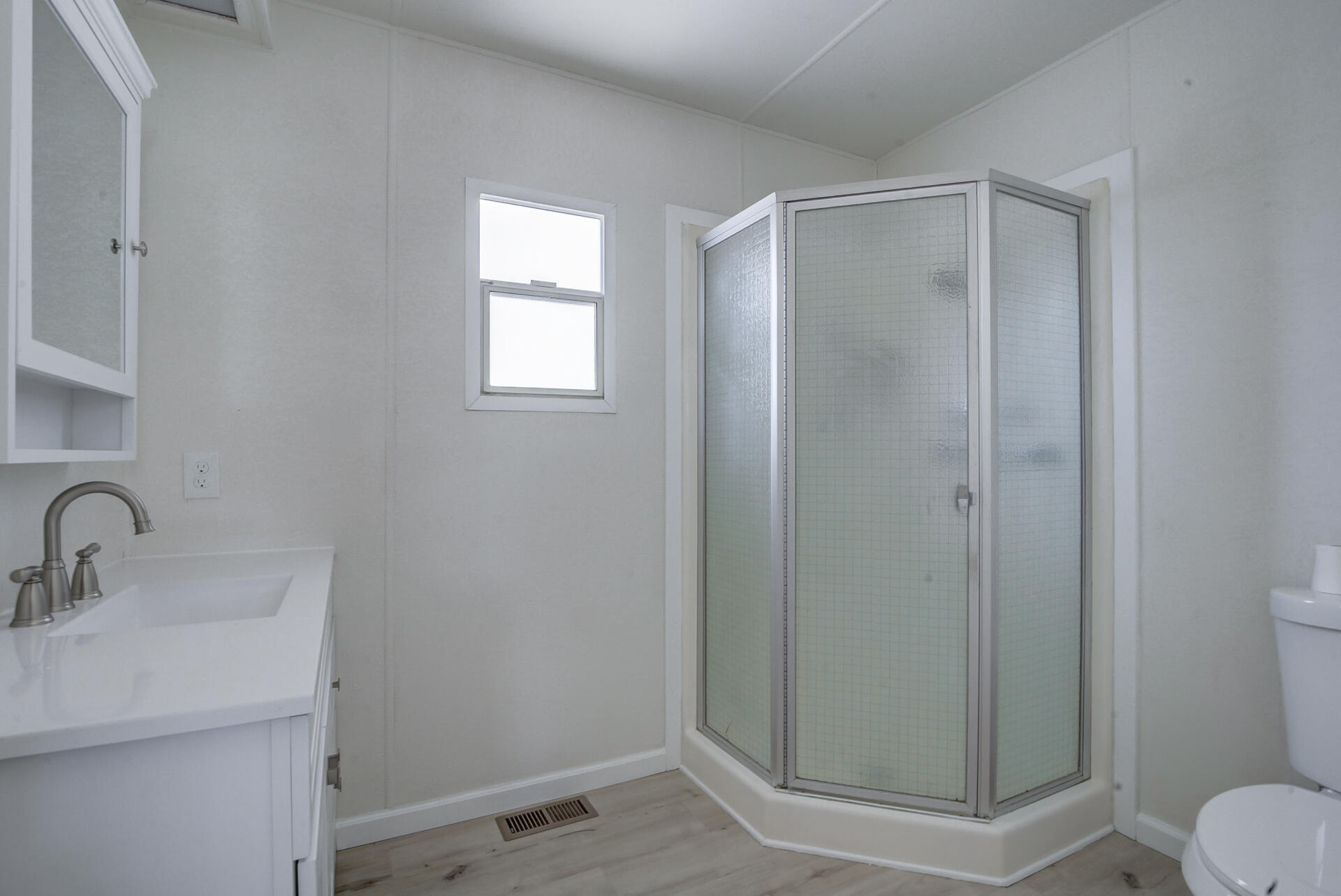 821 St Marks Street, Unit 1 Redding, CA 96003 - Photo 20 of 26 a bathroom with a shower a sink and toilet