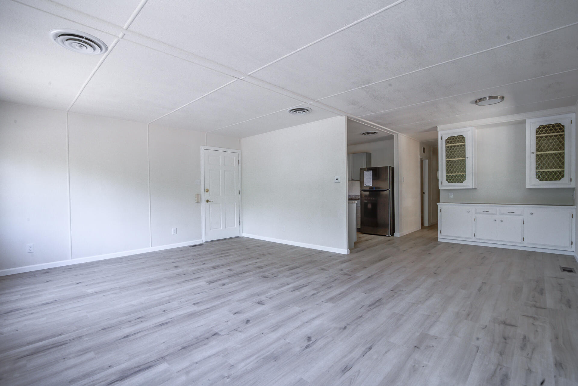 821 St Marks Street, Unit 1 Redding, CA 96003 - Photo 5 of 26 an empty room with wooden floor and a window