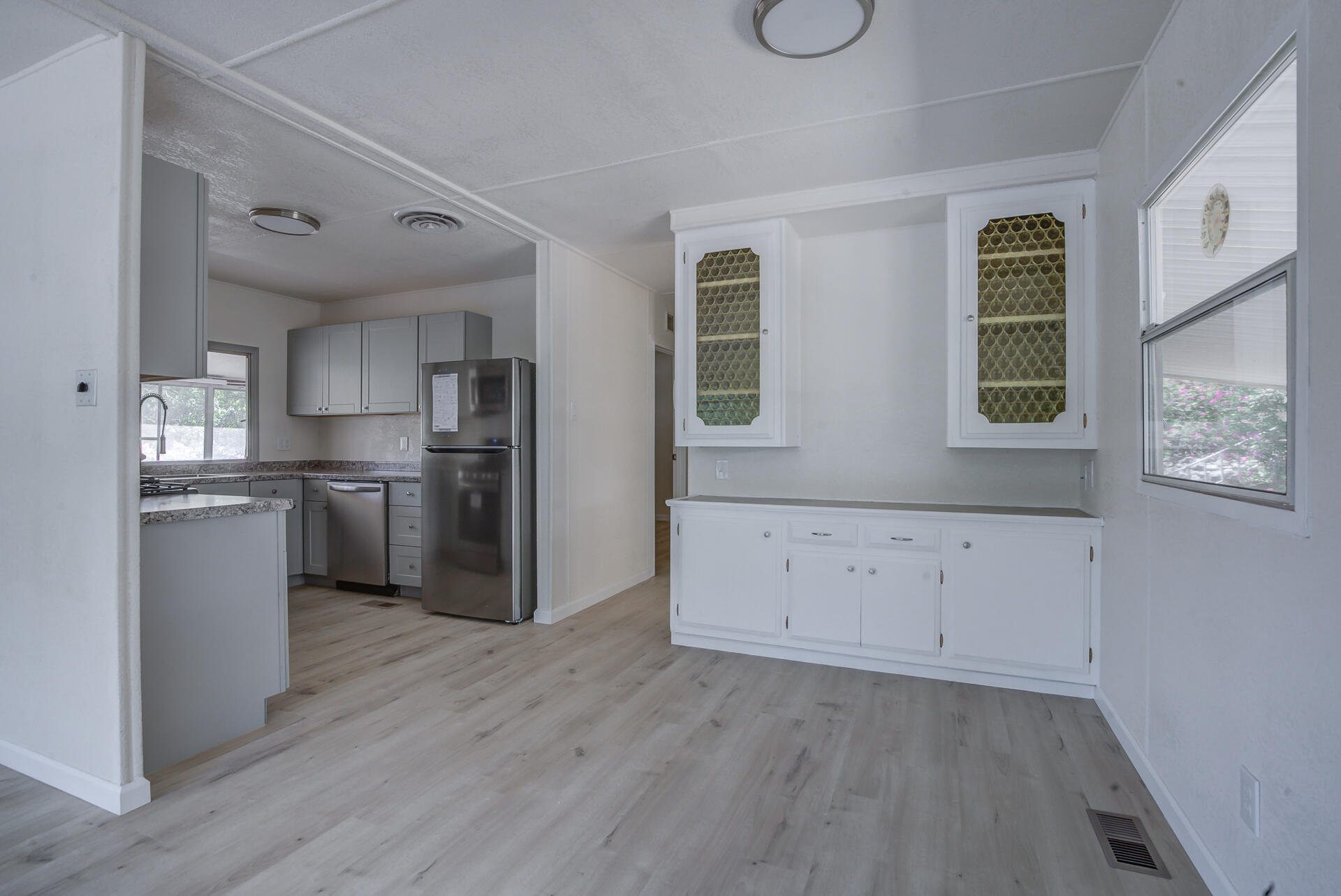 821 St Marks Street, Unit 1 Redding, CA 96003 - Photo 7 of 26 a kitchen with stainless steel appliances granite countertop a refrigerator and a stove