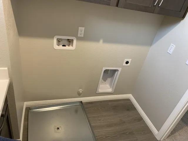 a bathroom with a double vanity sink mirror and shower