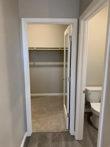 a view of an empty room with a hallway