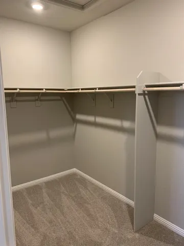 an empty room with a bathroom