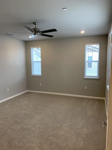 a kitchen with stainless steel appliances a sink a stove a refrigerator and cabinets