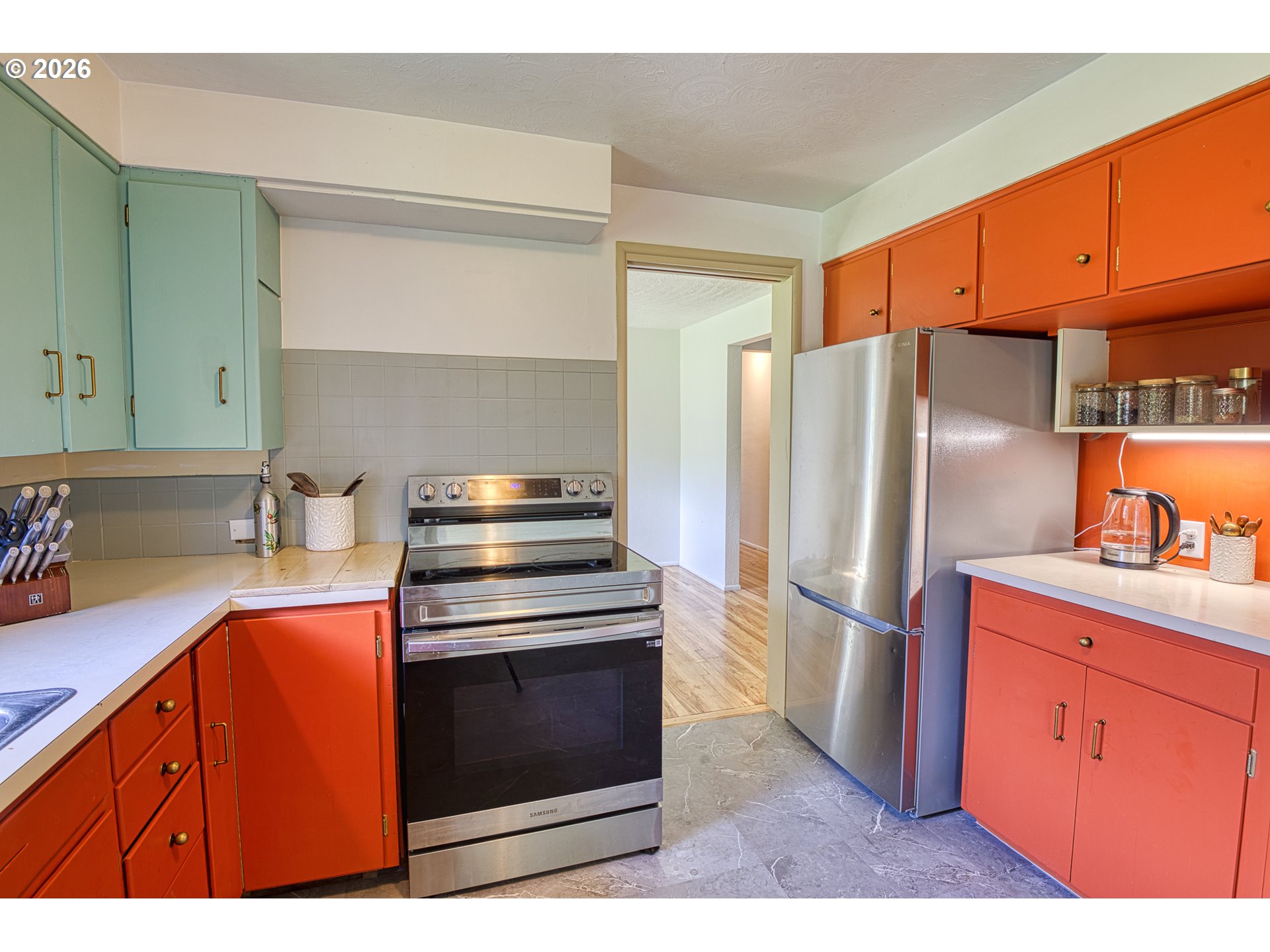 7077 Main Street Springfield, OR 97478 - Photo 8 of 34 a kitchen with stainless steel appliances granite countertop a refrigerator stove and sink