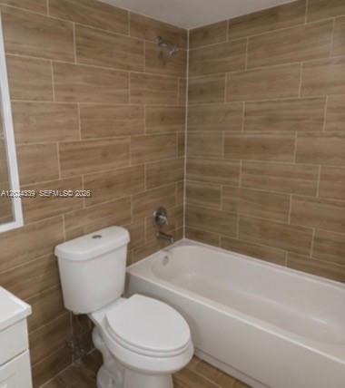 5401 Southwest 77th Court, Unit 202E Miami, FL 33155 - Photo 6 of 6 a bathroom with a toilet a sink and bathtub