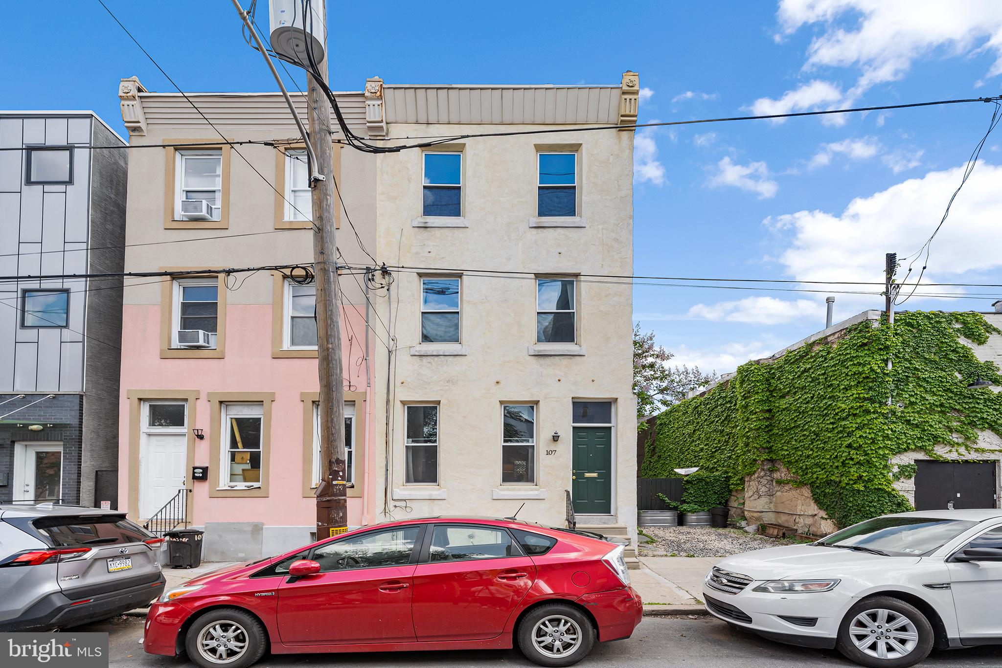 107 Master Street Philadelphia, PA 19122 - Photo 2 of 24 a front view of a building with parking space