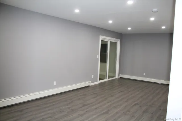 wooden floor and closet in a en suite bathroom