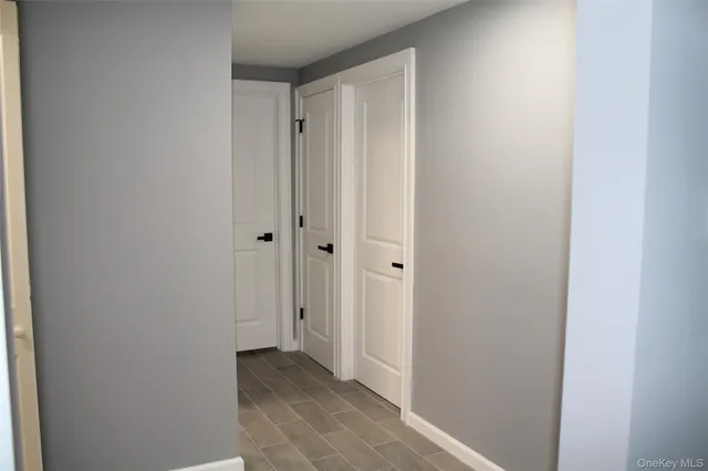 a white toilet sitting next to a bathroom sink