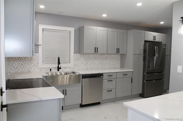 a kitchen with a sink stove and refrigerator