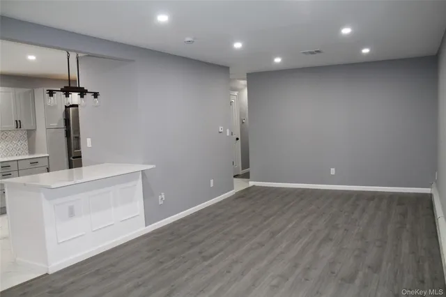 a view of kitchen with wooden floor