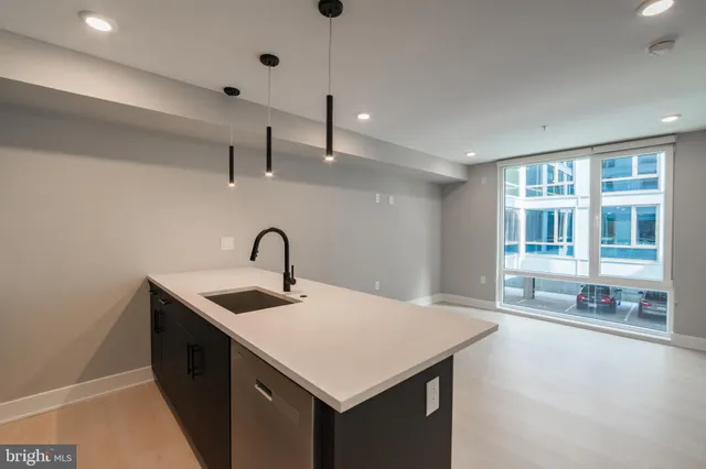 a kitchen with a sink and a refrigerator