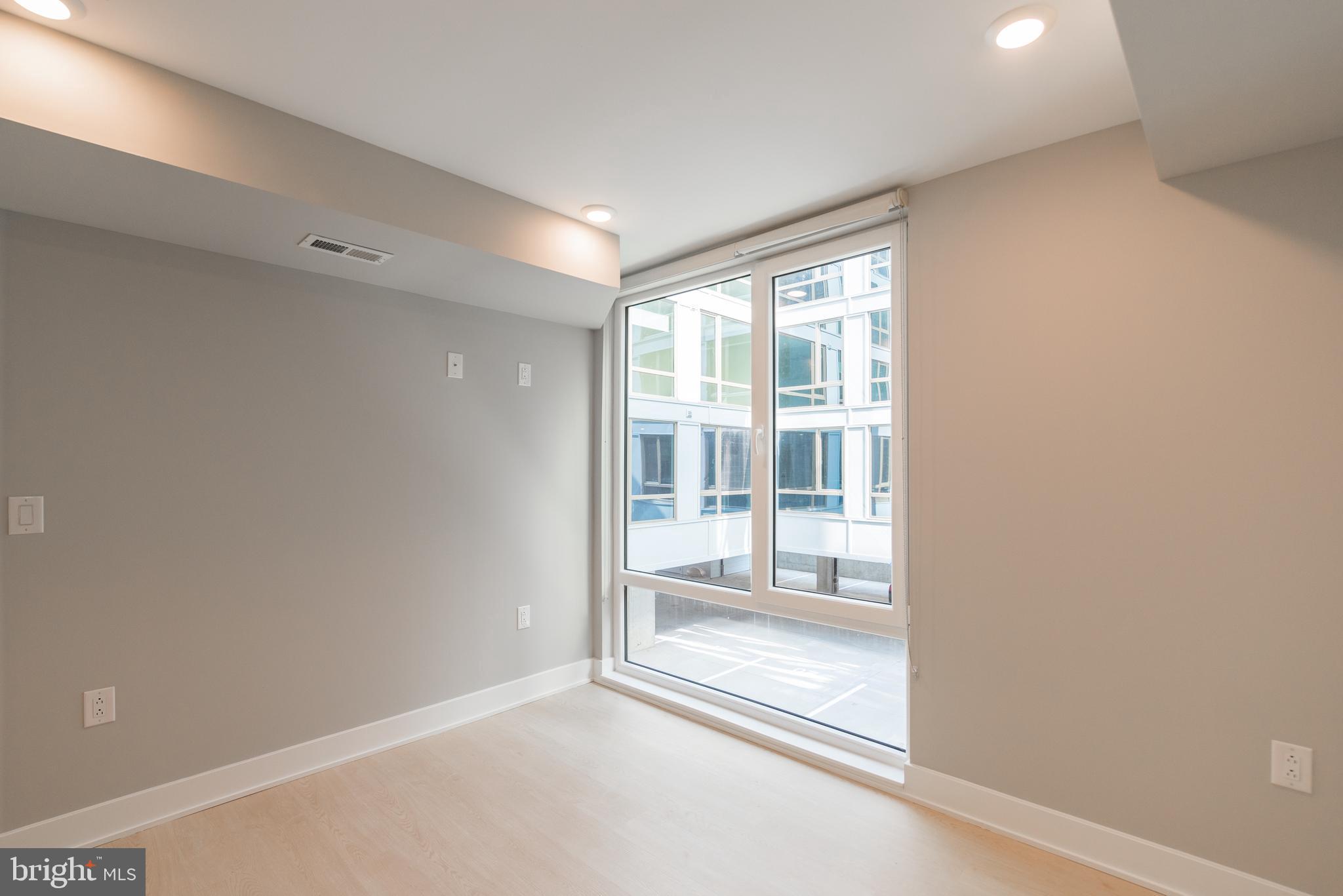 6604 Ridge Avenue, Unit 302 Philadelphia, PA 19128 - Photo 10 of 11 a view of an empty room with a window