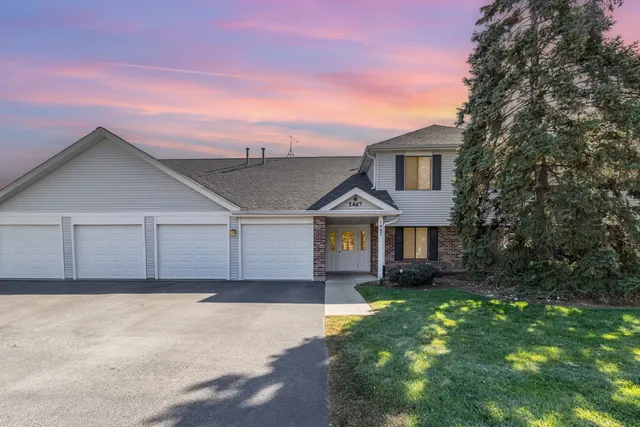 front view of a house with a yard