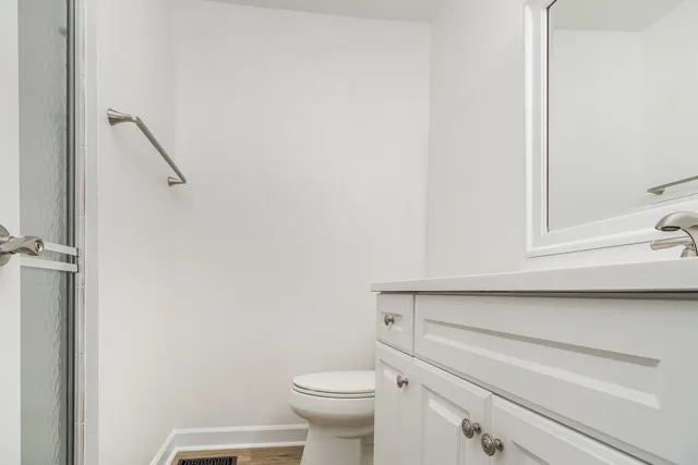 a bathroom with a toilet and a sink
