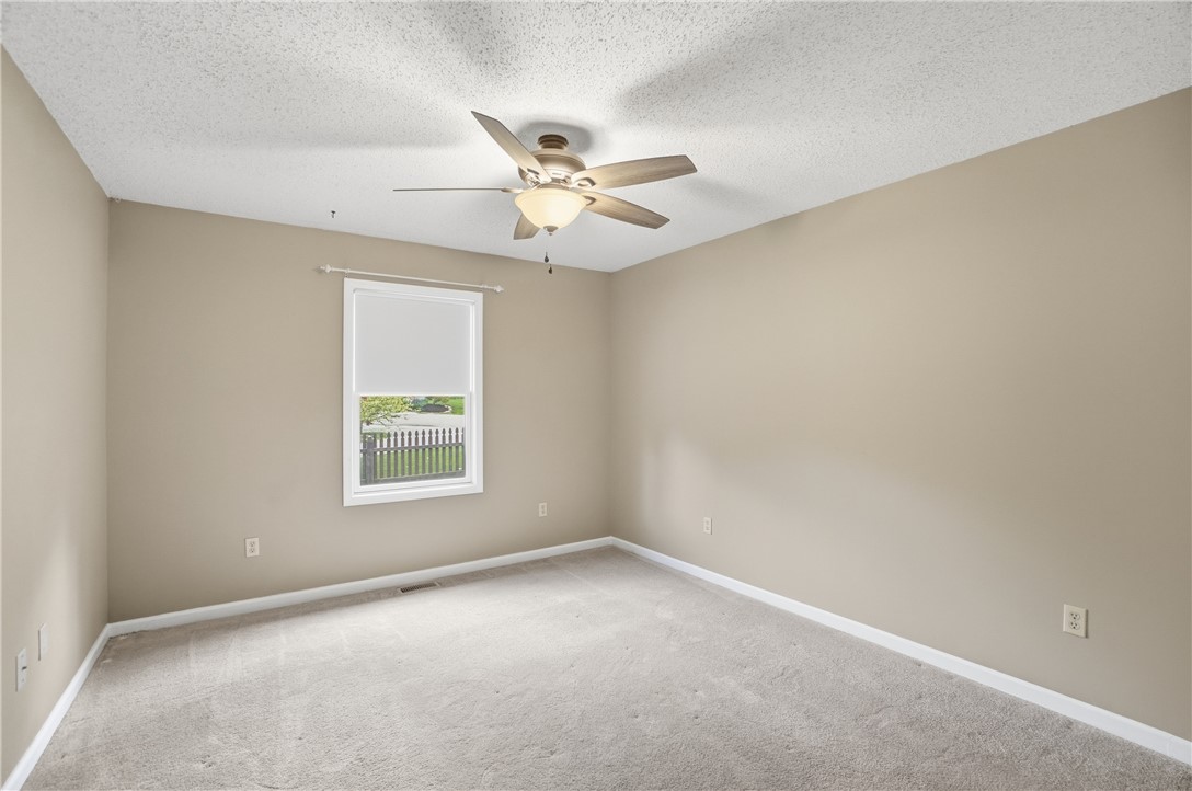 1208 Jarva Lane Springboro, OH 45066 - Photo 40 of 75 This spacious bedroom offers ample natural light and comfortable carpeting, perfect for relaxation.