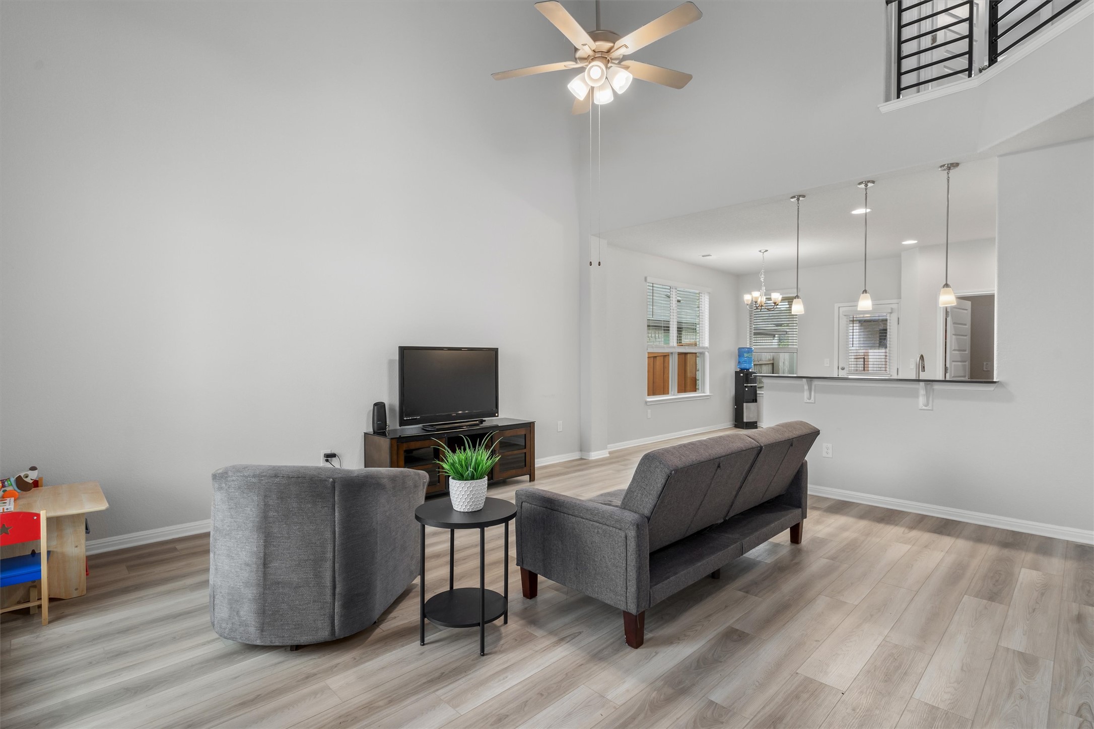 224 Backstays Loop Kyle, TX 78640 - Photo 5 of 19 Spacious interior featuring high ceilings, wood-finish flooring, and neutral wall tones