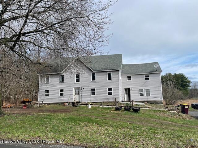 676 Highway 145 Cairo, NY 12413 - Photo 1 of 25 a view of a white house with a big yard and large trees